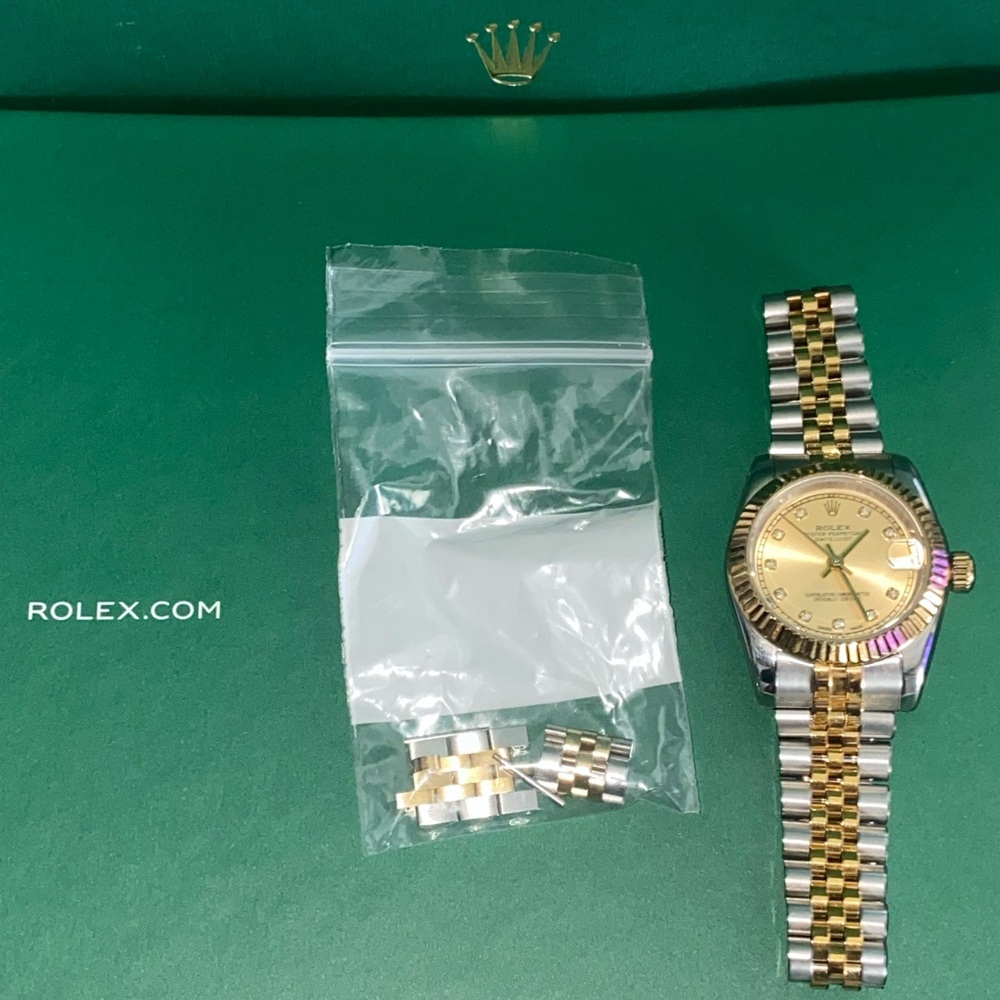 Gold and Silver Watch with diamond like stones